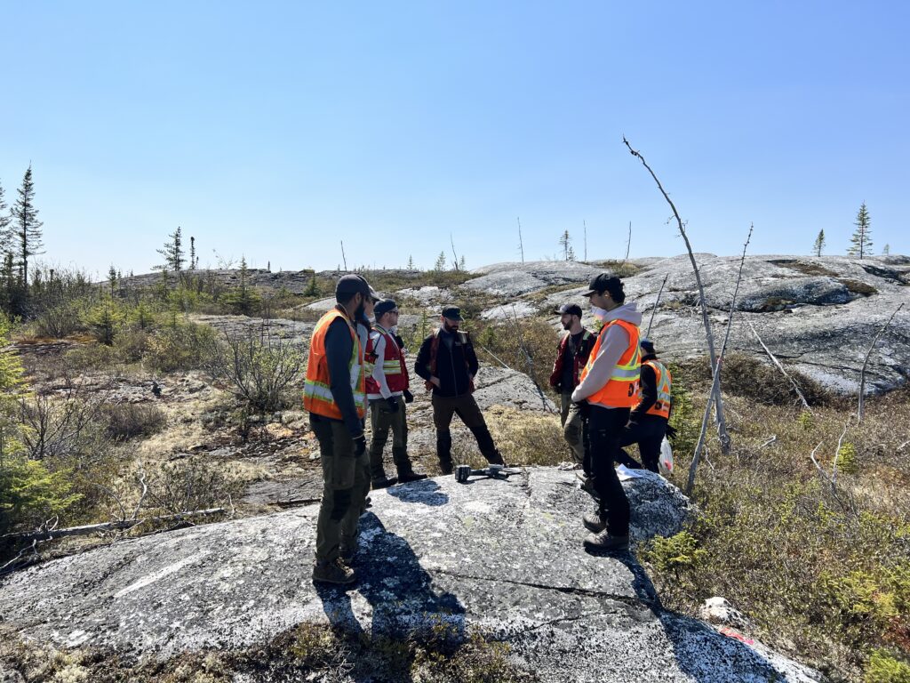 Geos Standing On And Around Outcrop