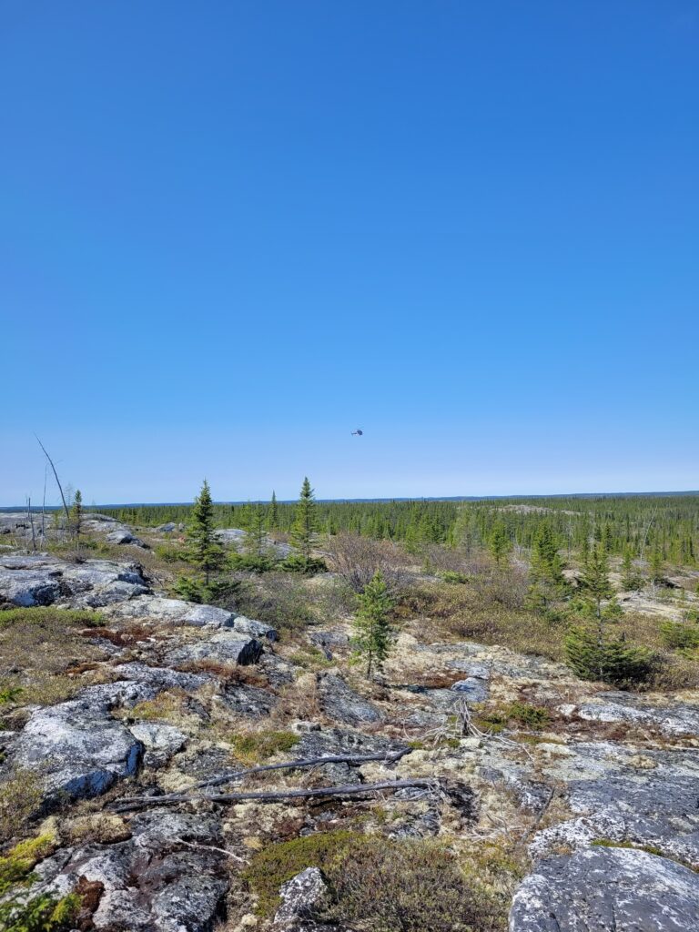 Outcrop And Helicopter In Distance June2023