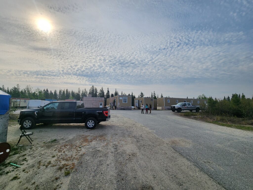 Trucks People And Awesome Sky At Camp